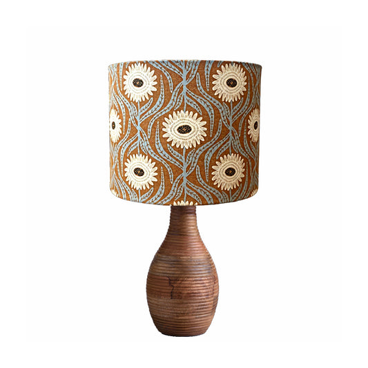 Bohemian lampshade with large cream flowers on a rusty background