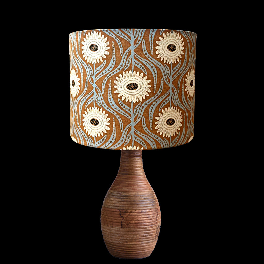 Bohemian lampshade with large cream flowers on a rusty background