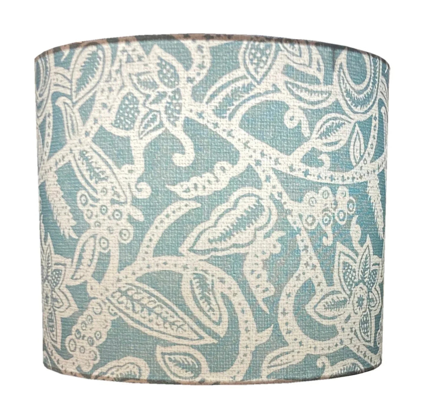 Teal and cream floral patterned drum lampshade with intricate botanical design