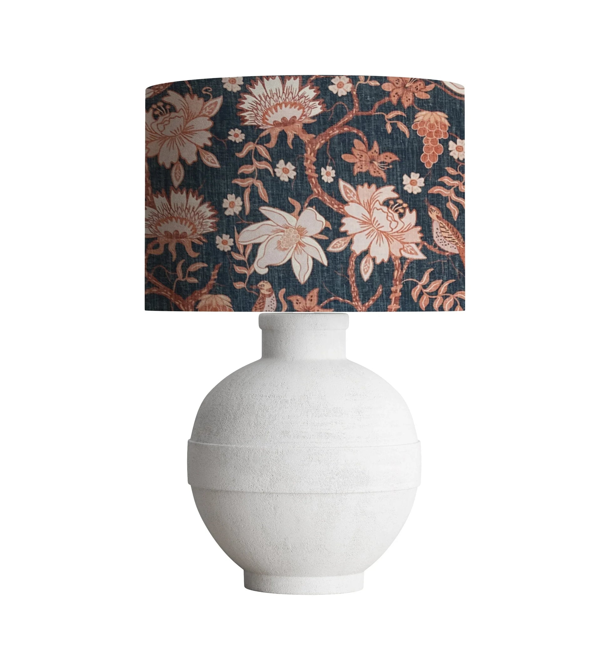 White ceramic table lamp with navy floral lampshade featuring birds and blossoms