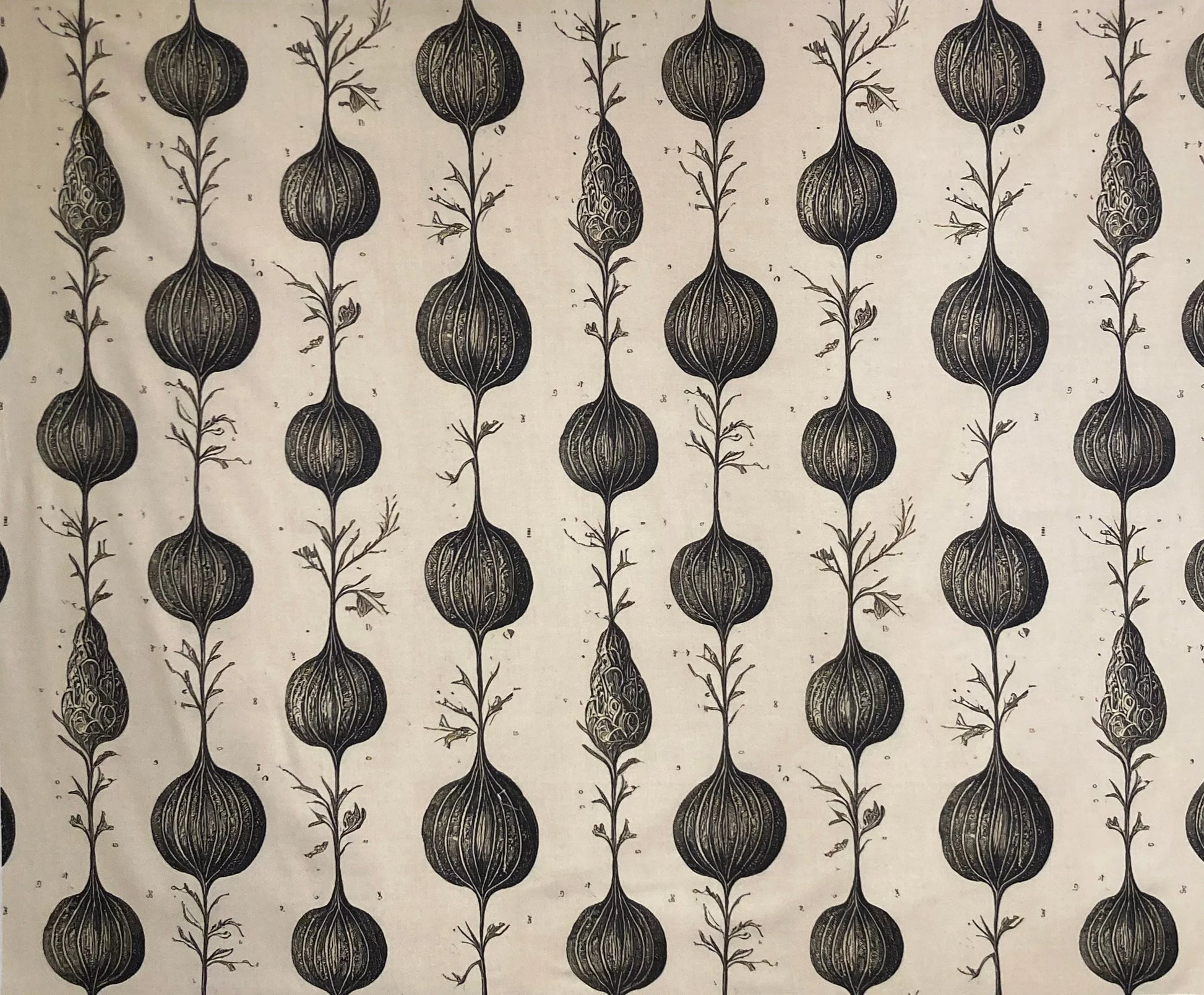 Botanical print fabric with black seed pod patterns on cream background, ideal for curtains or home decor