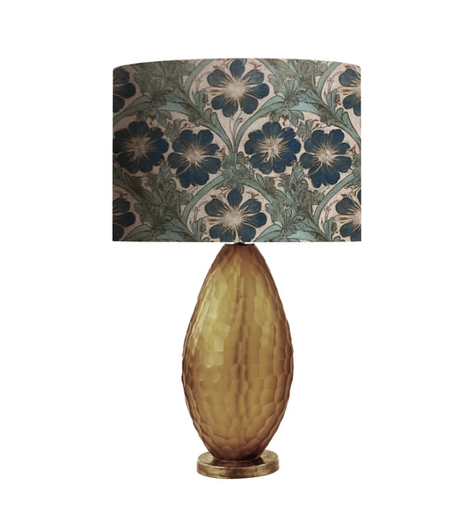 Floral pattern lampshade on textured gold base table lamp