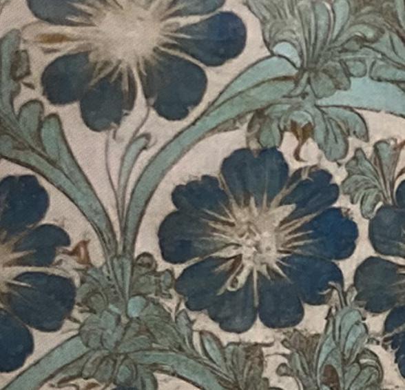 Vintage floral wallpaper with navy blue and teal flowers on cream background