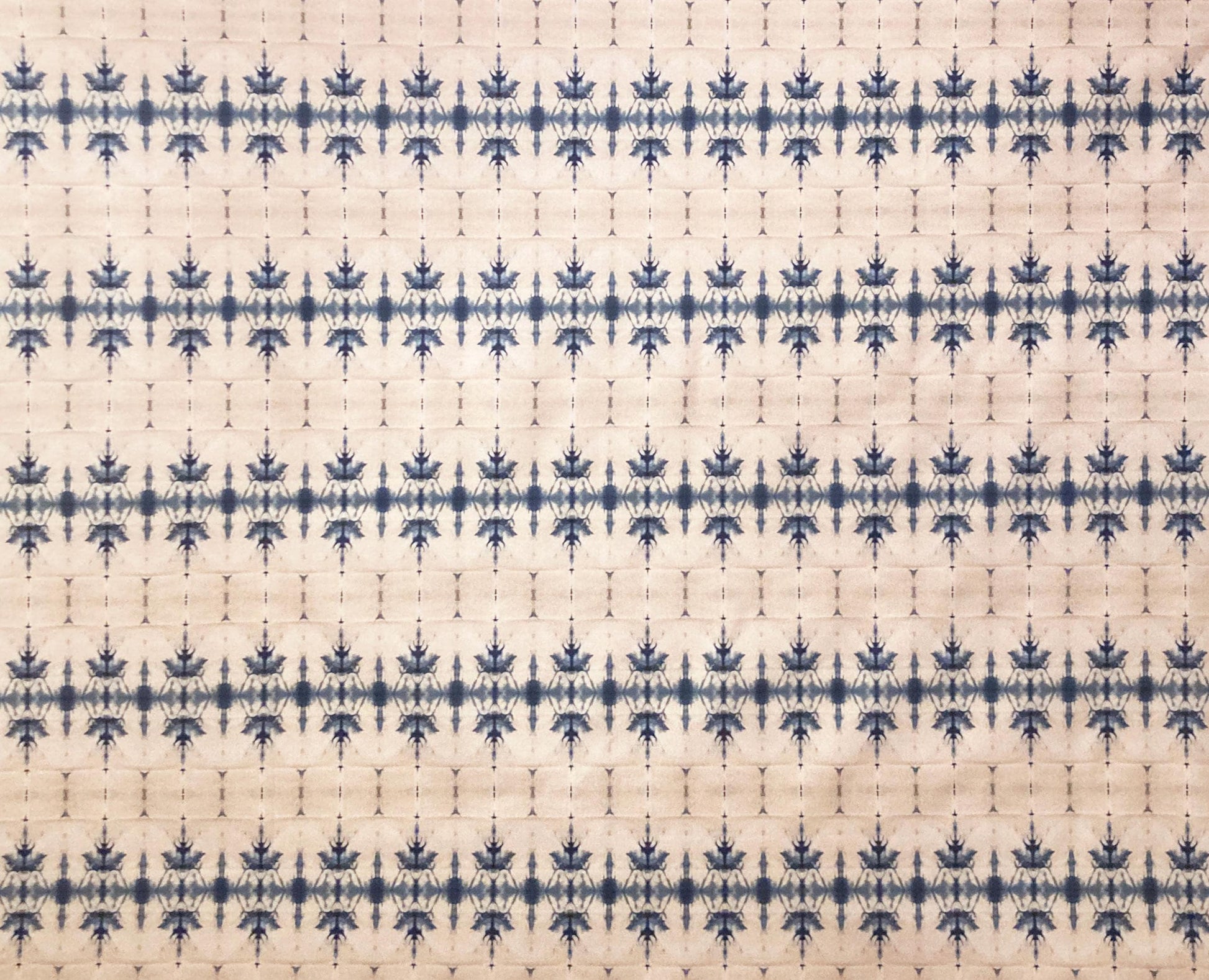 Blue and cream geometric patterned fabric with symmetrical design, ideal for curtains or home decor.
